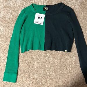 Selling love junkie green and black shirt for $46 never used before